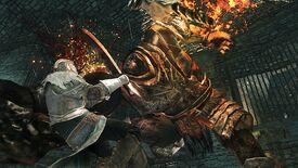 A huge armoured enemy smashes through a warrior's shield in Dark Souls 2.