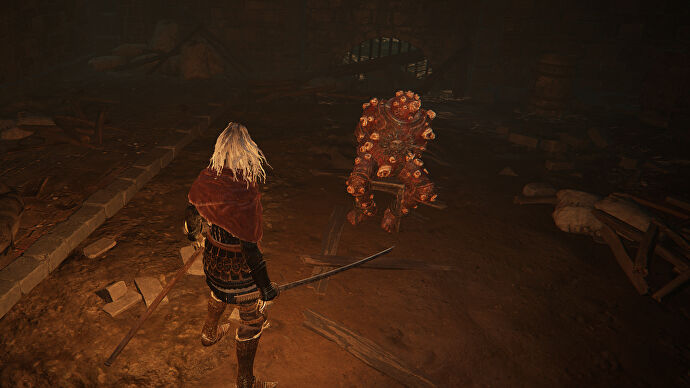 The player in Elden Ring stands before the Dung Eater, chained in a cellar beneath the Capital, Leyndell.