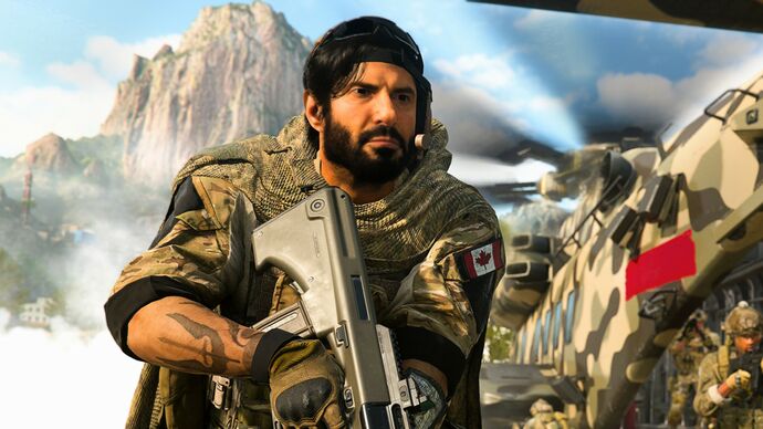 Modern Warfare 2 image showing a close up of a soldier by a helicopter, with a mountain in the background.