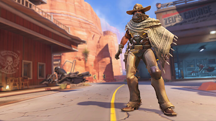 Cassidy, a hero in Overwatch 2, stands facing the camera on Route 66.