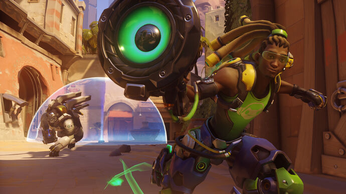 Lucio, a hero in Overwatch 2, skates towards the camera aiming his weapon. Behind him a Winston follows at a slower pace.